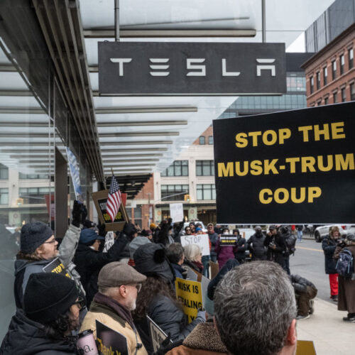 Protesters demonstrate outside Tesla showrooms in US