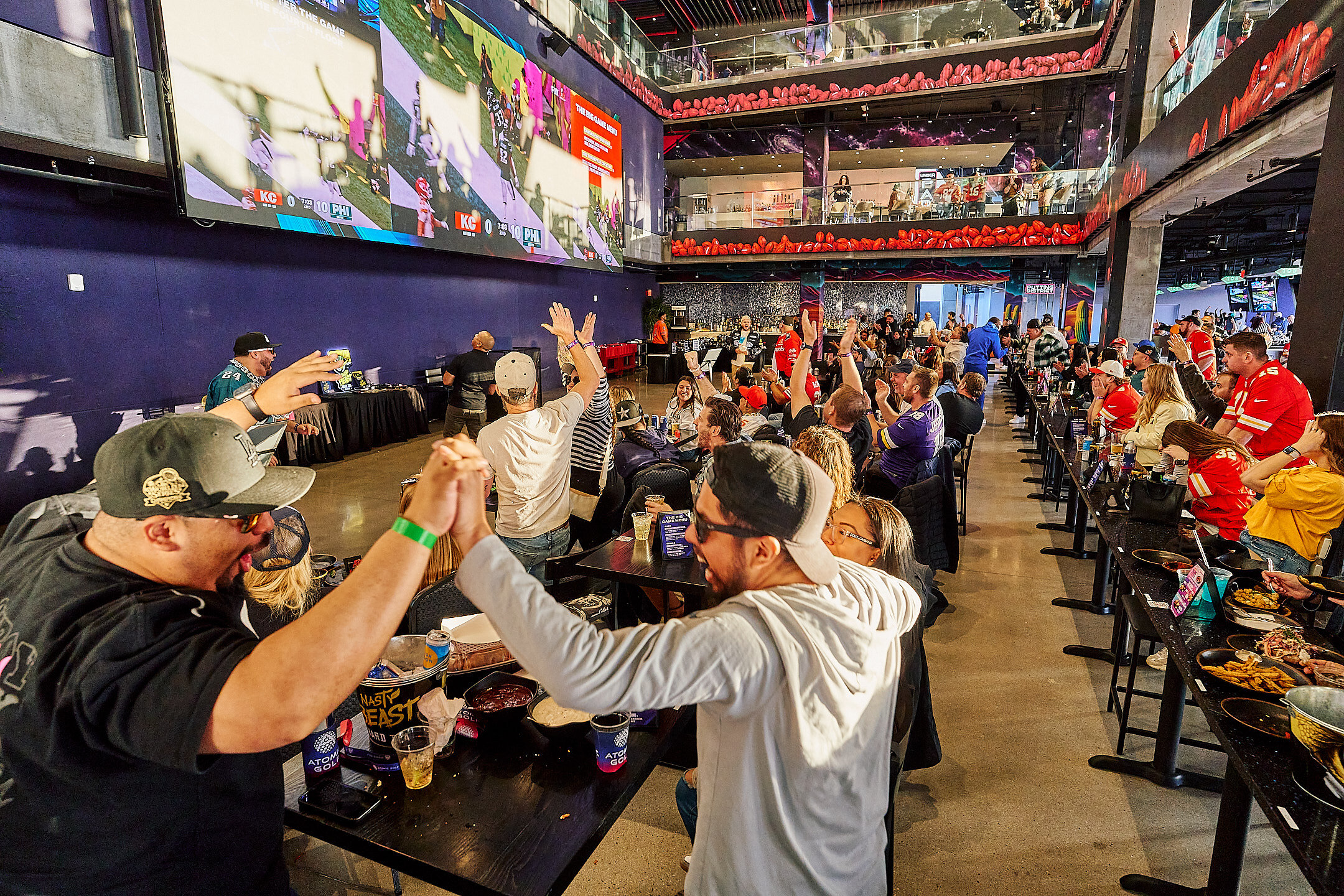 atomic-golf-brings-back-its-viral-all-inclusive-football-deal:-unlimited-food,-drinks-&-golf-for-$59